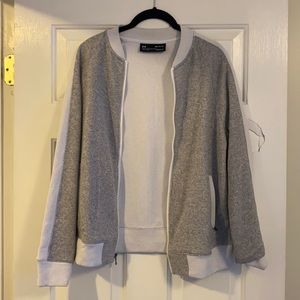 Gray and white Under Armour zip up